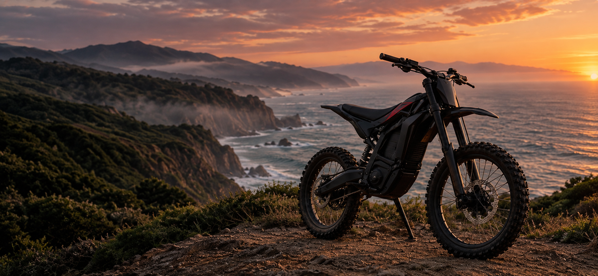 Electric dirt bike on a coastal trail at sunset